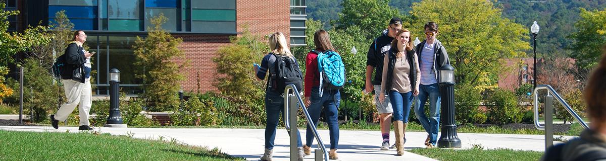 students climb the stairs in front of CCIT